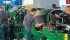 A tractor is dismantled piece by piece before a crowd of farmers in the Systems and Components Hall at Agritechnica in Hanover, Germany, earlier this month. | Michael Raine photo
