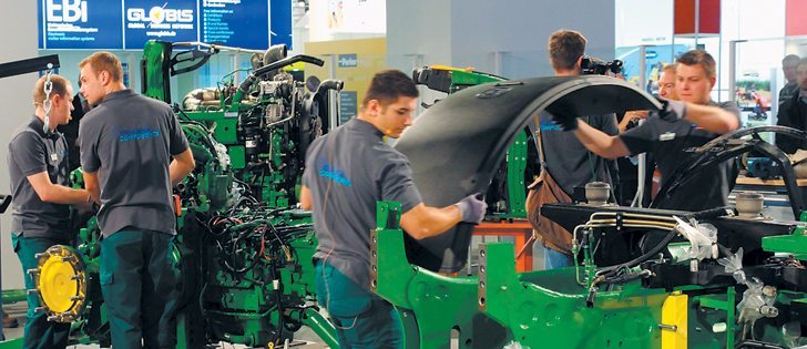 A tractor is dismantled piece by piece before a crowd of farmers in the Systems and Components Hall at Agritechnica in Hanover, Germany, earlier this month.  |  Michael Raine photo