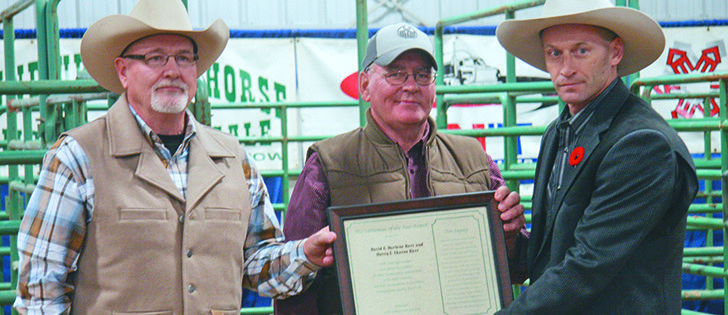David, left, and Harry Kerr receive the Cattlemen of the Year award from Lloydminster Exhibition president Vern Bexson. |  Kristen McEwen Photo