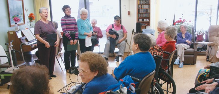 The Old Time Singers put on a show at Regency Manor care home in Central Butte, Sask. Some are full-time residents and others are drop-in clients picked up from surrounding communities. | Kristen McEwen photo