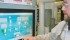 Plant employee Scott Bishoff uses a touch screen display to show how feed can be directed to different areas of the Canadian Feed Research Centre located at North Battleford, Sask. | Brian Cross photo