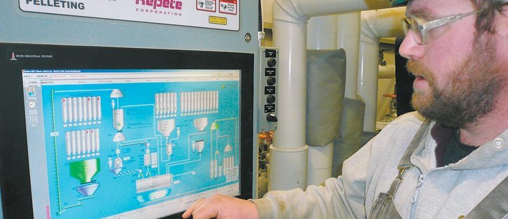 Plant employee Scott Bishoff uses a touch screen display to show how feed can be directed to different areas of the Canadian Feed Research Centre located at North Battleford, Sask.  |  Brian Cross photo