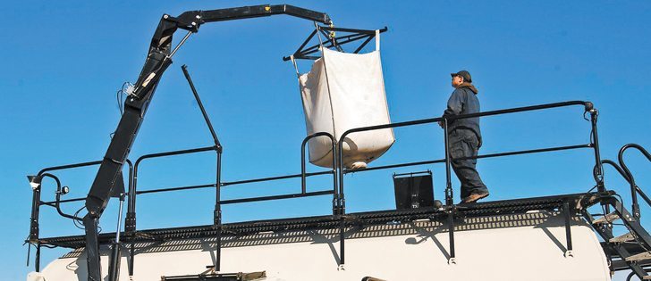 The new Bulk Boom can lift 2,400 pounds from the ground up to all tanks on the main cart.  |  Bourgeault photo