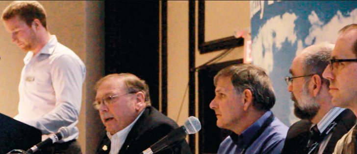 Iowa hog producer Bill Tentinger, centre, detailed what biosecurity steps he has taken to keep his farm free of PED.  |  Ed White photo