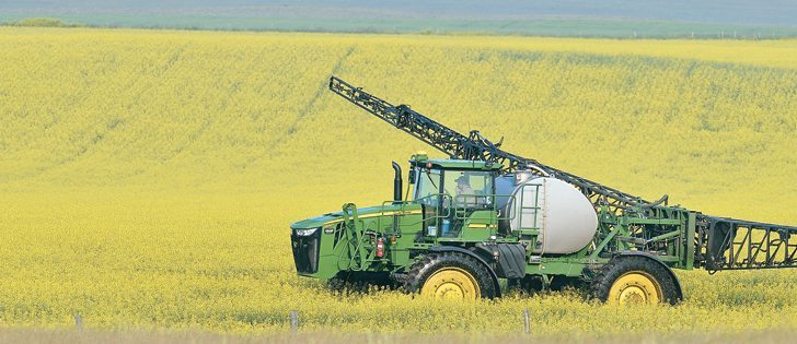 A farmer sprays a canola field west of Nanton, Alta., in mid-July. While crops are looking good in some parts of the Prairies, other areas are not faring well because of a late spring and excessive moisture. Temperatures near 30 C in southern Alberta over the past two weeks have not favoured canola, which thrives at cooler temperatures. |  Mike Sturk photo