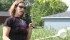 Danielle Grant shows off the dipper she uses to collect mosquito larvae from standing water. If there are larvae present, she may treat the area with a natural product containing a bacteria that kills them. The product is granular and is spread with a small unit that resembles a grass seeder. | Barbara Duckworth photo