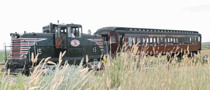 Southern Prairie Railway engineer Devon Generous hooks onto the Pullman Coach for its return trip to Ogema, Sask. The SPR locomotive is a fully-restored 1945 GE 44-Tonner Center Cab. SPR organizers found the locomotive in North Conway, New Hampshire.  |  Brian Cross photo
