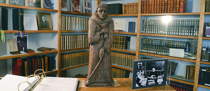  A statue of Father Bacciochi, a Corsican priest, who settled in Swift Current, Sask., and friend of Father Athol Murray, stands on guard in the rare book collection room.  | Arlene & Robin Karpan, photo.