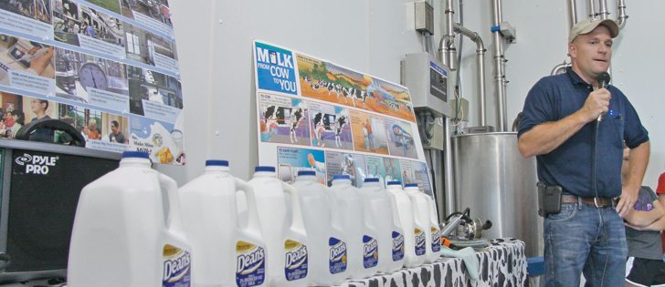  Joe Kelsay of Kelsay Farms uses a line of milk jugs to show visitors to the farm how much milk one cow produces each day. |  Mary MacArthur photo