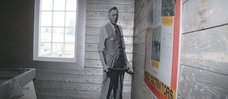 A life-sized cardboard cutout of farmer and inventor Charles Sherwood Noble stands in the corner of the factory where the first Canadian Noble blades were built. The site is now home to the Nobleford Area Museum Society.  |  Barb Glen photo