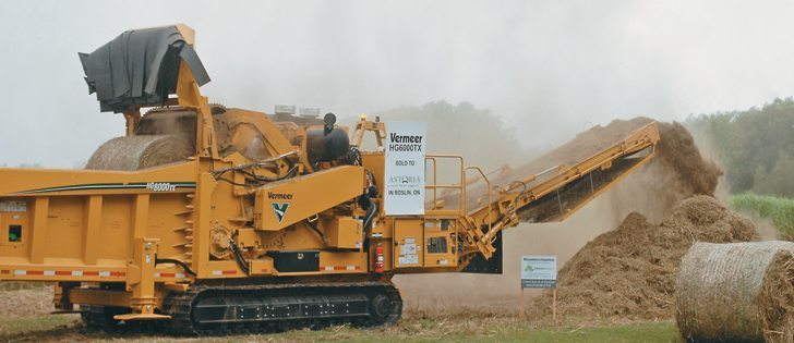 The Vermeer horizontal grinder makes short work of two large, round miscanthus bales. This unit is priced at about $800,000.  |  Jeffrey Carter photo