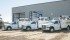 Three Claas service trucks sit outside the Canada West Harvest Centre east of Regina. | Robin Booker photo