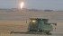 Louis Hannotte combines barley about one kilometre south of the finger of flame from a TransGas pumping station near Prud’Homme, Sask. | William DeKay photo