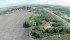 A SkyHawk-1 drone flies above prairie farmland. | Ben Parry photo