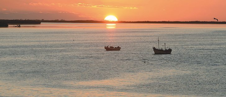 The sun sets over Rio Lagartos. | Robin and Arlene Karpan photo