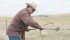 Michael Burgess fixes the neighbour’s fence after discovering some cattle out during a tour of the Circle Y Ranch. | Karen Briere photo
