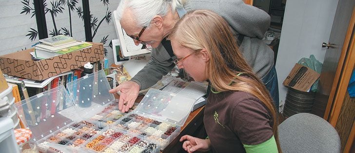 Jim and Rachelle Ternier examine the wide variety of seeds they save every year at Prairie Garden Seeds. The family operates gardens at their home farm at Cochin, Sask., and at St. Peter's Benedictine Abbey at Muenster, Sask. | Karen Morrison photo