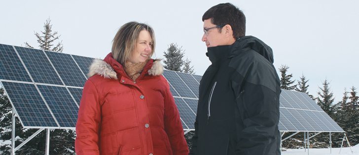 Leigh and Dan Mazier of Justice, Man., are learning to balance work, family life and community service. The solar panels are part of a pilot project with Manitoba Hydro.  |  Ed White photo