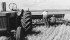 George Loree, right, checks a discer while seeding into stubble near Parkland, Alta., in June 1960. | File photo