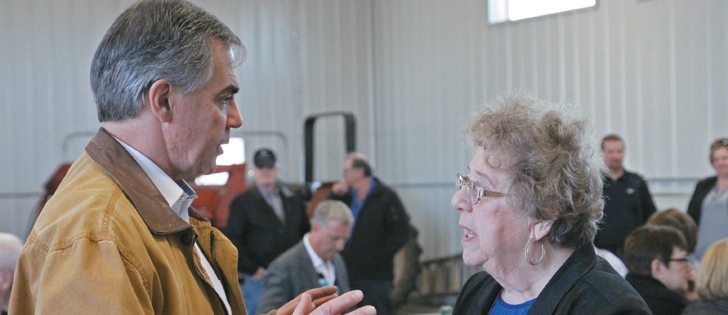 Mary Readman of Consort, Alta., corners PC leader Jim Prentice about rural hospitals, especially the need to reopen rural hospitals.  |  Mary MacArthur photo