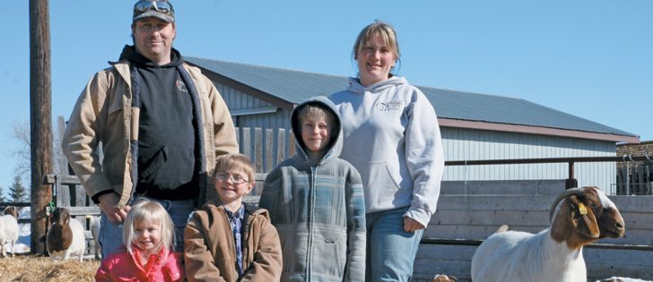 Shay and Laurie Fries, along with Shelin, 3, Gauge, 5, and Hunter, 9, raise cattle and goats on their Alberta farm. |  Mary MacArthur photo