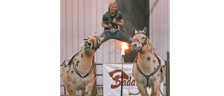 Selena Dickman of Carmangay, Alta. does the splits during her act with her pair of Fjord horses at the Mane Event in Red Deer. |  Mary MacArthur photo