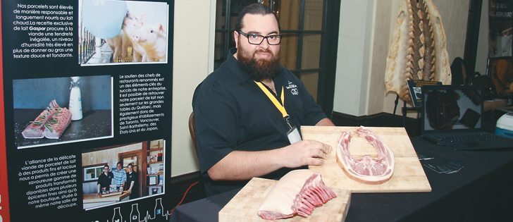 Dominic Paquette shows off the unique cuts of pork offered by Gaspor Fermes St. Canut. Producers from across Canada supported by Community Futures, the developmental lender and business support organization, were featured during meals and presentations and at displays.  |  Karen Morrison photo