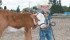 Three-year-old JD Olson bottle feeds his Hereford heifer Sue-ee at the family farm near Southey, Sask. He brought her to the Pense Pizza Farm planting day, to represent milk and cheese in the agriculture awareness project. | Karen Briere photo
