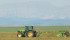 A farmer cuts hay in a field south of High River, Alta. It is one of the few regions that received precipitation last month. | Mike Sturk photo