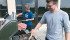Chase Kendall, left, and Jeremy Wiebe do agronomic research at the Carman University of Manitoba research farm, as well as flip burgers for farmer tours. | Ed White Photo