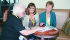 Lori Camire, left, Wendy Smitka and Mary Ellen Heidt discuss the Economic Gardening and Venture Connect programs and how they help rural regions. | Karen Morrison photo