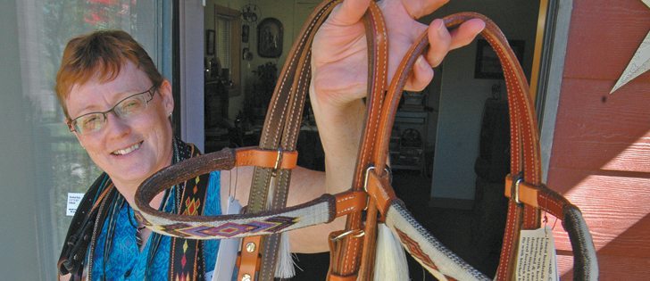 Donna Murray holds up a bridle featuring some of her hitched horsehair designs. Each piece can take many hours to make. She tries to include a personal touch when making belts, blankets, jewelry and other items. | Barb Glen photo