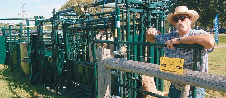 Doug Bidulock, sales representative for Hi-Hog, demonstrated cattle handling equipment during Canada’s Outdoor Farm Show in Woodstock, Ont.  |  Jeffrey Carter photo