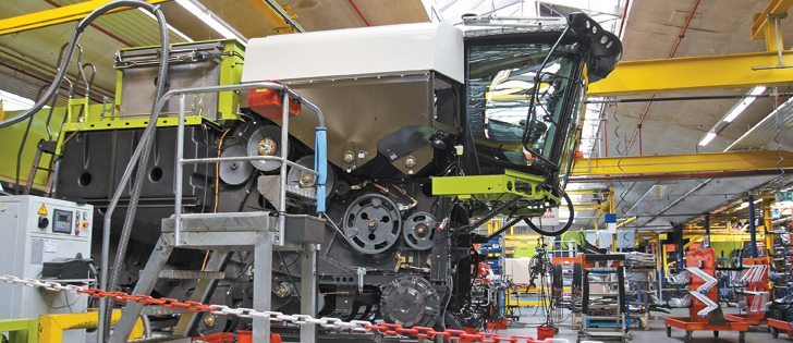 A new Lexion combine waits for completion at the Claas plant in Harsewinkel, Germany. The company employs 3,300 of its 11,400 staff in the small community in northern Germany.  Factory floors cover 50 acres of the 100 acre Claas site in Combine City. | Michael Raine photo