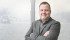 Greg McDonald, standing in front of a wall mural with the company logo, says United Suppliers Canada’s, new relationships will improve its members product and service offerings. | William DeKay photo