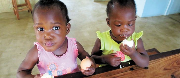 Children enjoy some of the first eggs produced at the farm.  |  International Egg Foundation photo