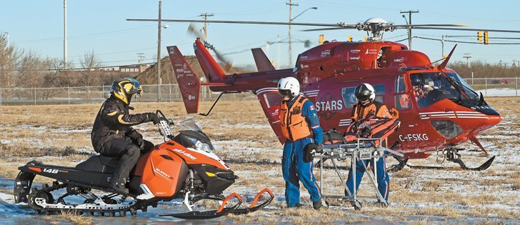 STARS and Ornge air ambulance services performed a mock demonstration of a snowmobile accident at the STARS air hanger in Saskatoon, Dec. 8. The organizations are partnering to raise awareness of snowmobile safety to reduce snowmobile related injuries and fatalities. |  William DeKay photo
