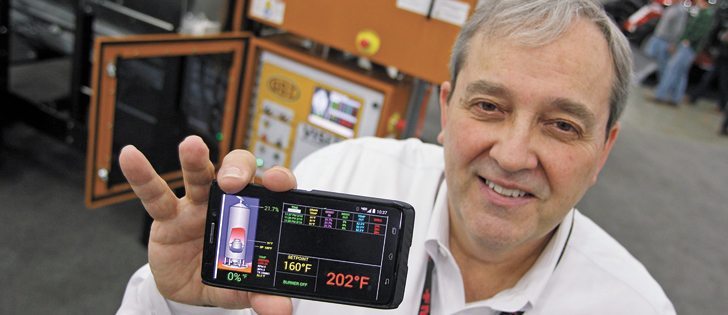 Gary Woodruff of GSI says the new technology allows for remote operation and monitoring of its dryers. |  Michael Raine photo
