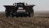 A potato planter makes its way up the field as Ryland Nakamura of Nakamura Farms plants 130 acres of spuds April 10 west of Barnwell, Alta.