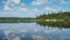 This is an example of breaking the rules. While it’s usually best to avoid putting the horizon across the centre of a photo, this image of Mountain Lake in northern Saskatchewan works because of the strong reflection in the calm water. | Arlene & Robin Karpan photo