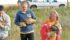 Owen Huvenaars, left, Savanna van der Wielen and Jessica Brummelhuis of the Hays
4-H Club carry their mature pheasants to a
release habitat.
| Vanessa van der Wielen photo