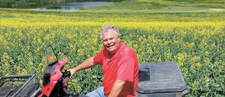 Graham Caskey uses a quad for easy access to all parts of his farming operation near Oyen, Alta.  |  Caskey family photo