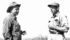 Howard Buchanan of Govenlock, Sask., left, talked with Oscar Wyler, district manager of Saskatchewan Agriculture’s conservation and development branch, in July 1958 in a brome and alfalfa field in the Spangler Irrigation Project in southwestern Saskatchewan. | File photo
