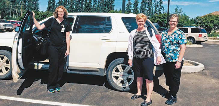 Home care nurses Tracy Hughes, Faye Street and Marion Linke are based in the Kelsey Trail Health Region. Bringing care to the patient is part of the home care philosophy, but regions have tough choices to make on limited budgets.  |  Shirley Byers photo