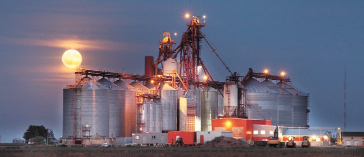 A full moon rises over the Richardson Pioneer grain elevator and service centre in Corrine, Sask., Aug. 18.  |  Michael Raine photo