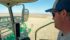 Signs of excessive rain can be seen out the window of the combine as Robert Ellis takes a crop off near Elrose, Sask. | Brian Cross photo