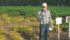 Agriculture Canada researcher Bob Conner is pleased with his efforts to produce a sickly bean crop, explaining to field tour participants how researchers encourage diseases to find ways to fight them. | Ed White photo
