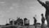 Section men pause to let a diesel train go by at Asquith, Sask., in this undated photo. | File photo
