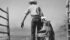 Doc Dogertom, a cowhand from the Cabin Creek Ranch near Cowley, Alta., carries his saddle back to the tack room after a busy morning helping ranch owner Bob Burles gather cattle in this undated photo. | File photo