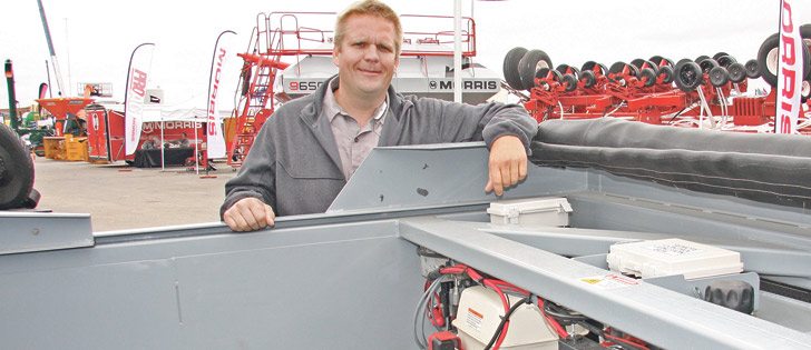 Niel Somero says his Advanced Nimble Trailer System has its own on-board gas engine, hydraulics, electrical system and winch. The moving rubber floor is nearly seven feet wide and 16 feet long.
| Ron Lyseng photo